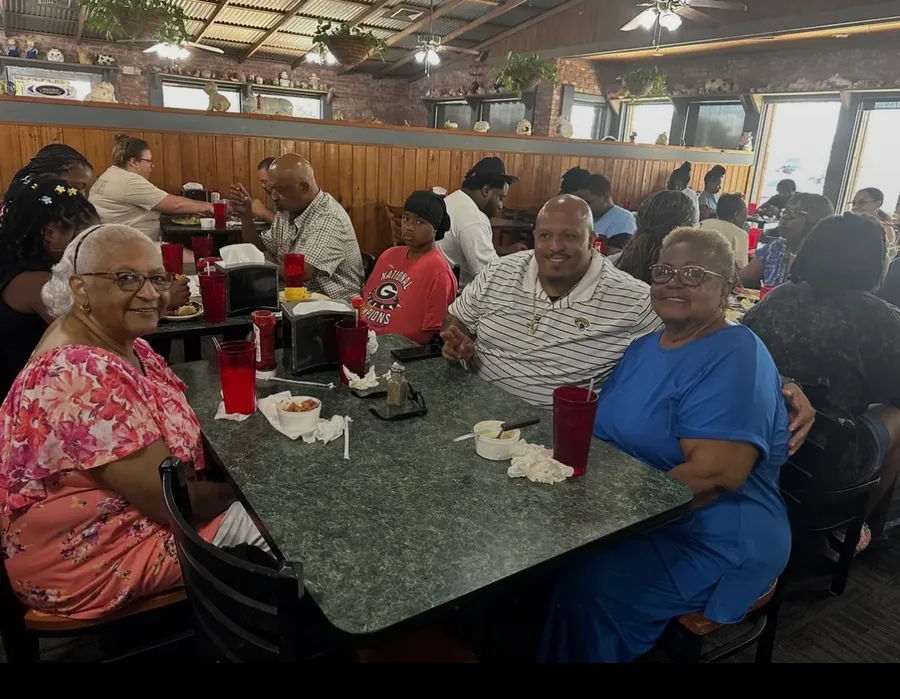 The elders gathered around tables for a family meal.